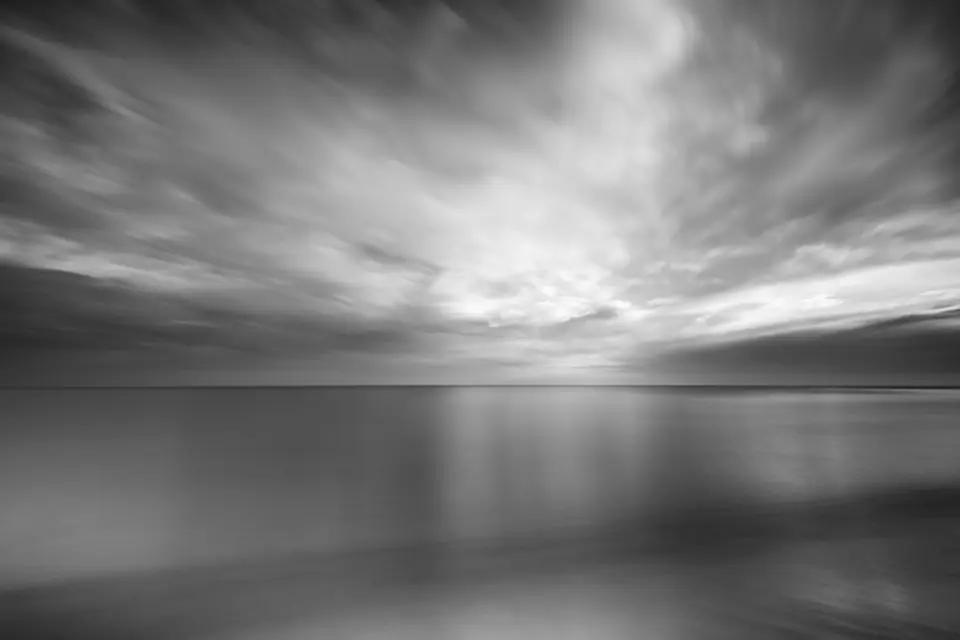 Black and white long exposure ocean with dramatic clouds